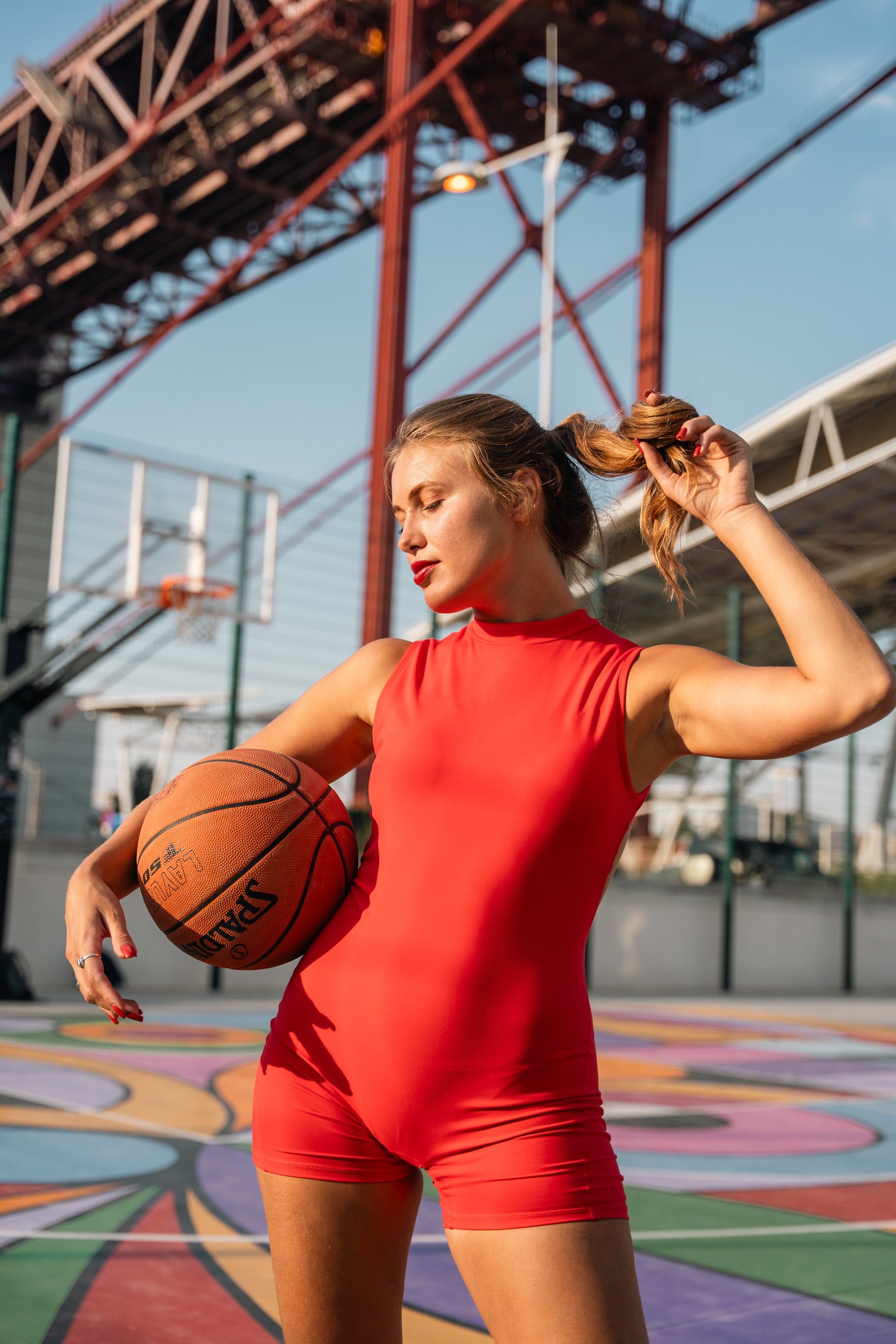 Athletic red jumpsuit for women — flexible, breathable, and form-fitting design ideal for yoga, fitness, or casual streetwear.